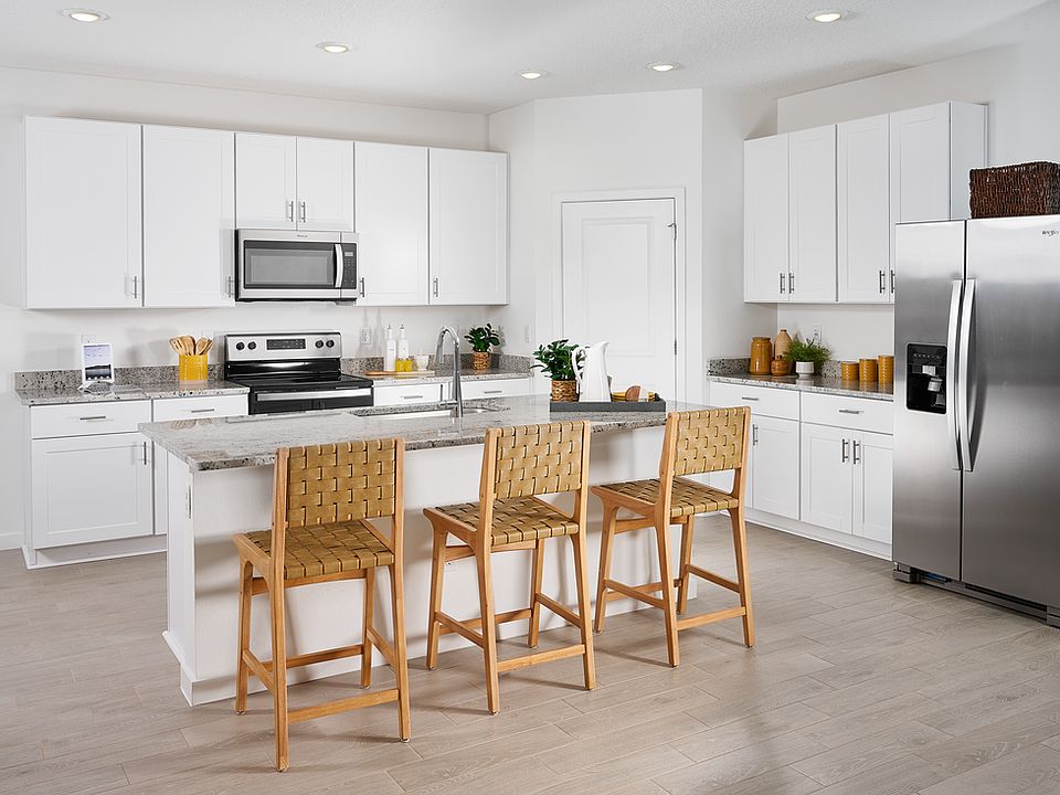 Kitchen of the Orchid Plan modeled at Lakes at Bella Lago.