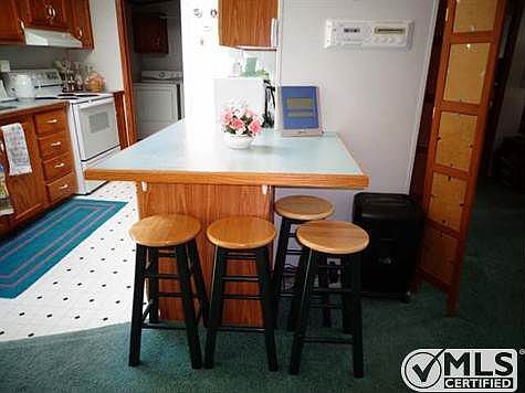 Eat at bar between kitchen and dining