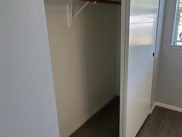 Bedroom 2 closet with shelf.