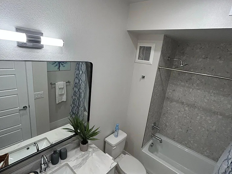 Powder Bath and 2nd Bed room bath right across hallway