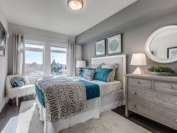 Lux apartments have large bedroom spaces with plenty of natural light and ample space for a queen-sized bed and dresser