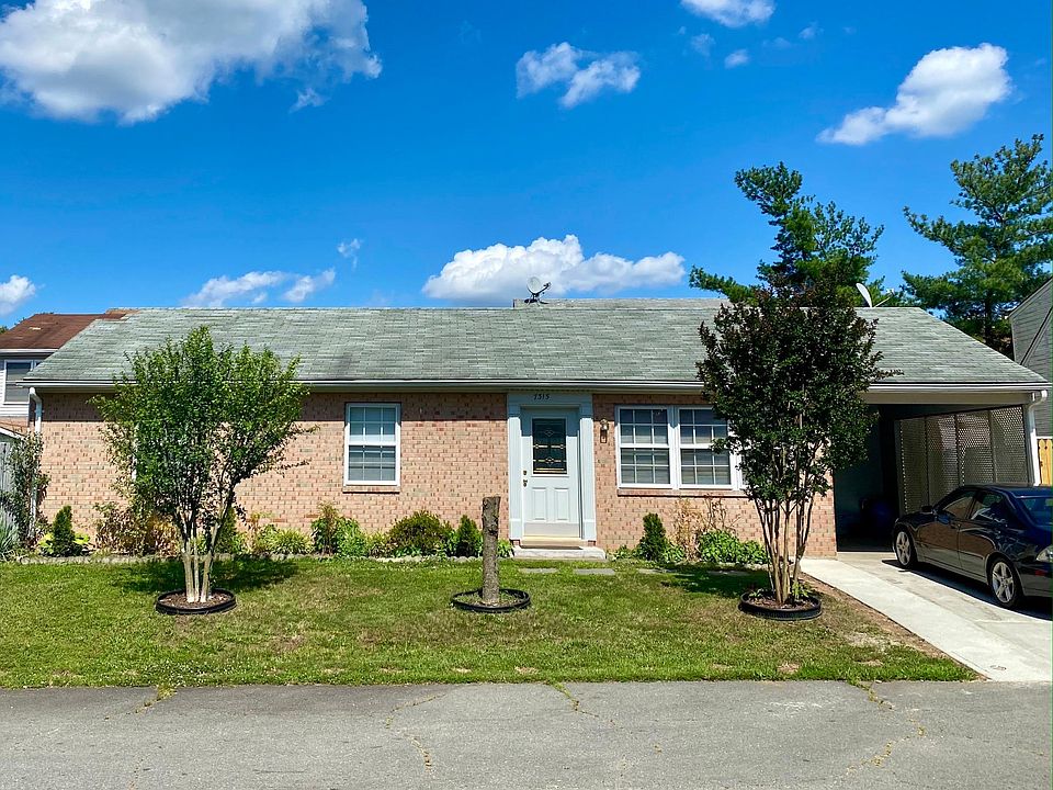 Front of house with carport