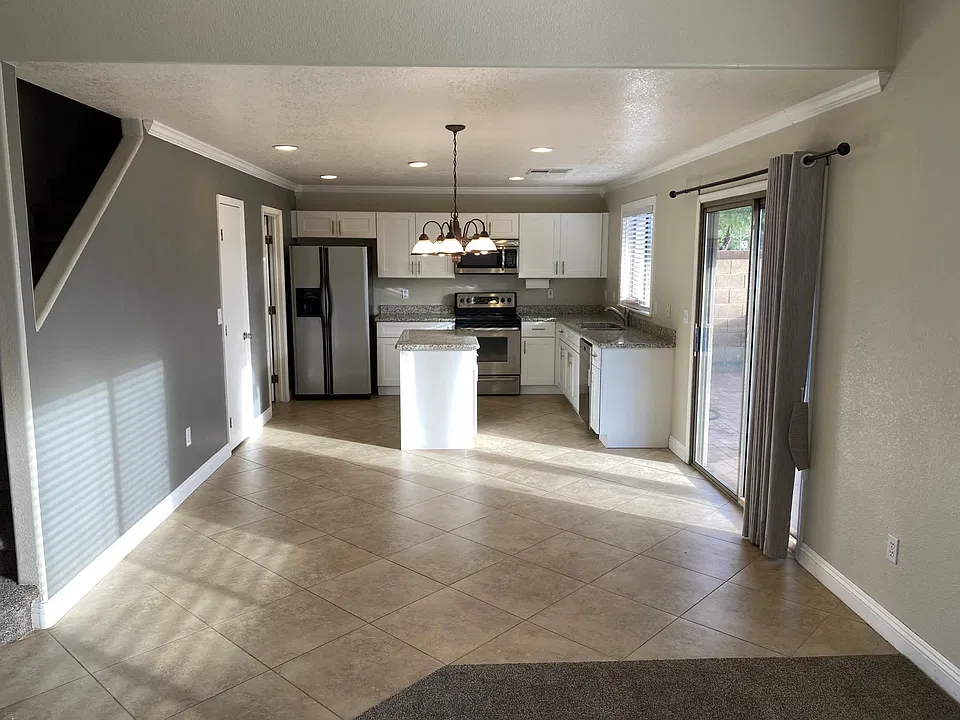 Newly updated kitchen with Shaker cabinets and granite countertops.