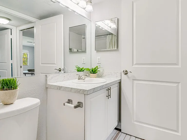 Check out our renovated bathrooms with large mirror and extra storage!