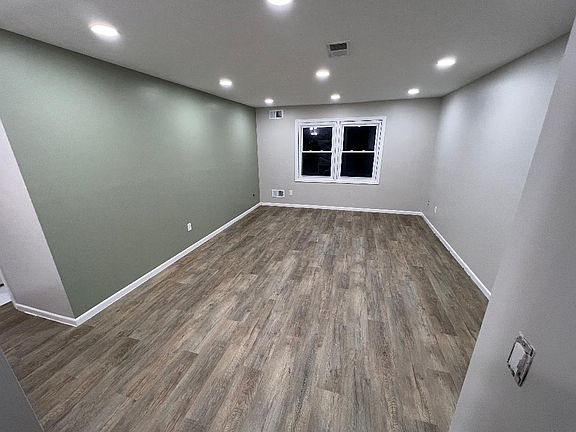 Large Living Room/Dining Room with newer Flooring and Paint!