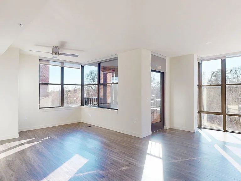 Apartment living room with wood-style flooring.