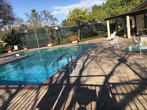 One of swimming pools with jacuzzi
