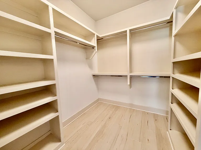 one of the two walk in closets in the primary bedroom