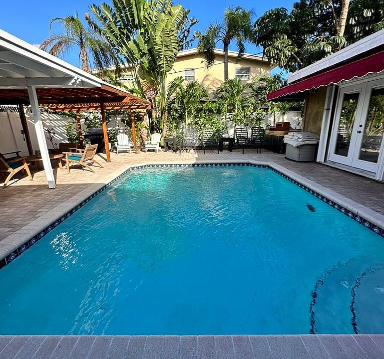 Luscious and private backyard with pool.