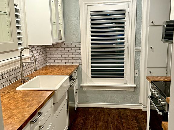 Kitchen with all new appliances, new cabinets and new windows, covered by beautiful custom plantation wood shutters.