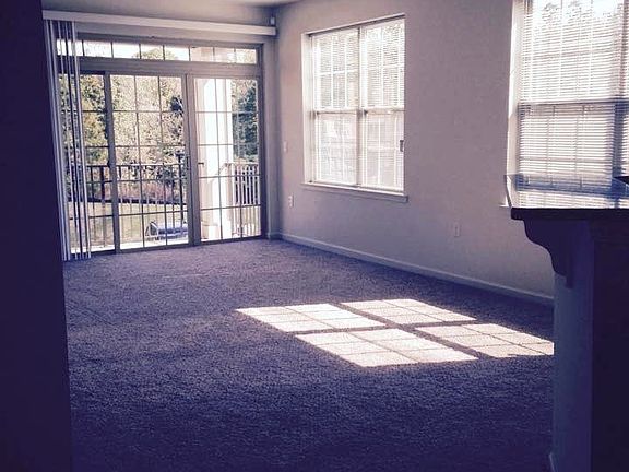 1 bedroom corner unit living room view with natural sunlight