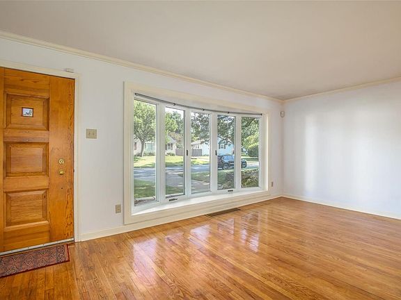 Original solid wood front door. Freshly painted walls. Beautiful refinished wood floors. Large bow window offering tons of natural light.