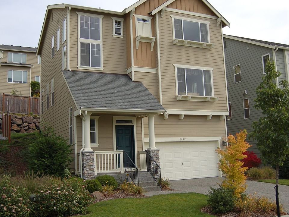 Front of Home. Two-car garage with plenty of storage space. Low maintenance ya