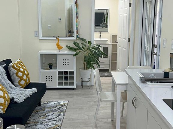 Kitchen and bathroom entry.