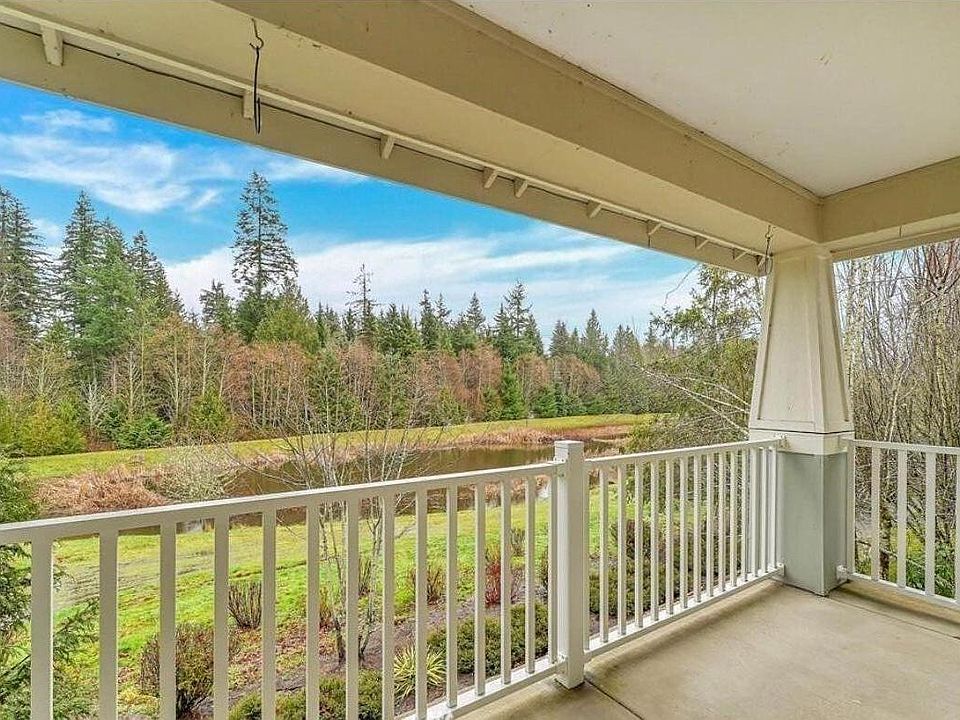Balcony facing pond and green belt