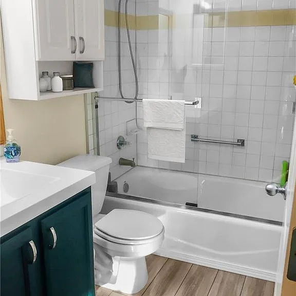 Main bathroom with tub and shower.