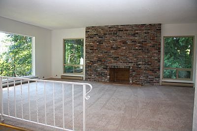 Living room with brick fireplace
