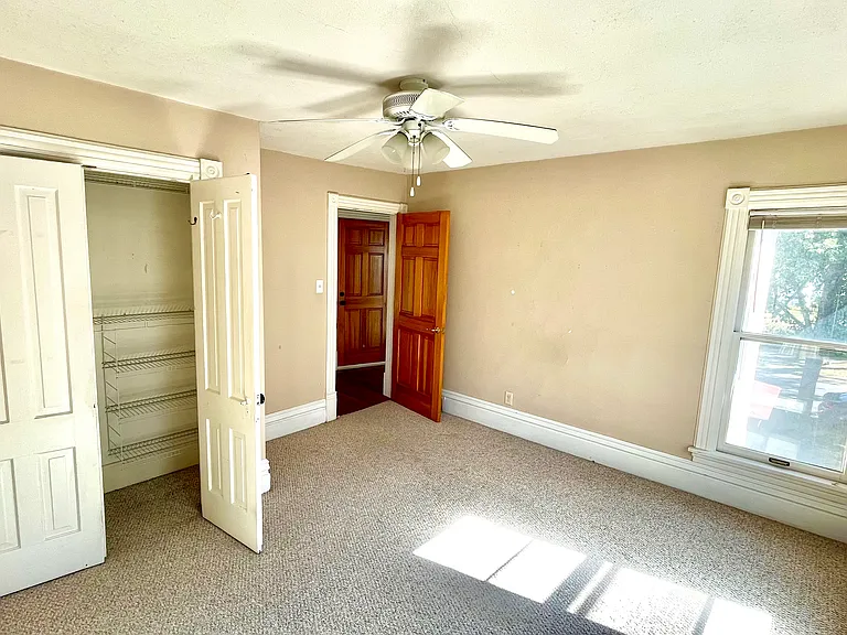 Large bedroom with double door closet.