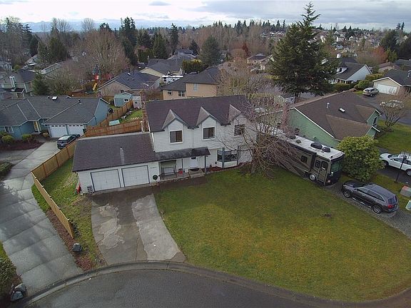 On a quiet cul-de-sac, this home offers large graveled RV parking.