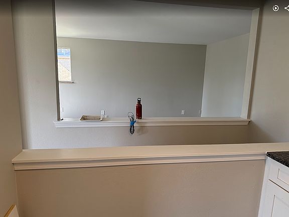 view from kitchen looking into living room