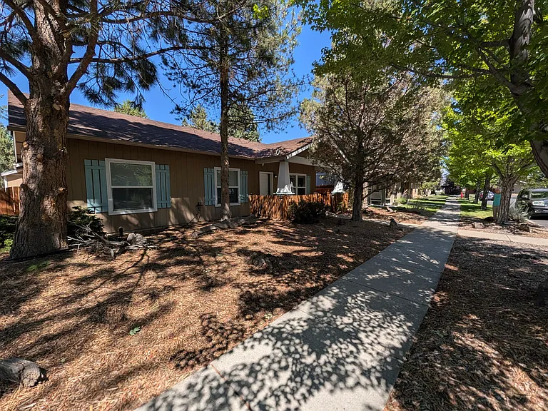 Shady front of the house on a tree-lined quiet street