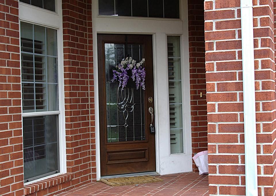  Mahogany front door with pretty leaded glass.