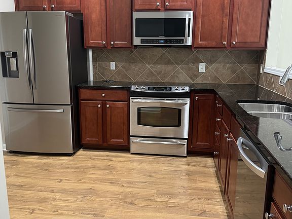 Kitchen with Stainless appliances, including a NEW LG dishwasher.