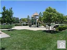 Watch the kids at the park from your front porch.