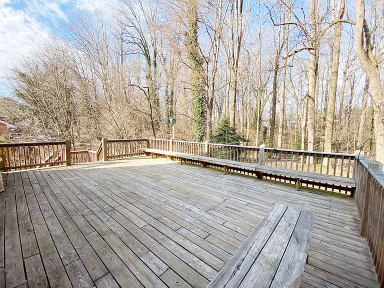 large deck with private view of backyard