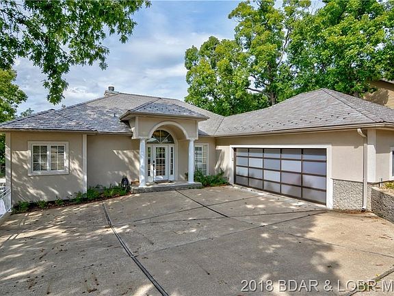 This completely updated 5 bedroom home is in a deep water cove in beautiful Four Seasons! As soon as you pull in the driveway yo