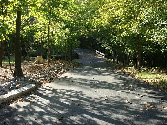 Drive 700 feet on my private driveway over 2 bridges to your secluded wooded paradise!