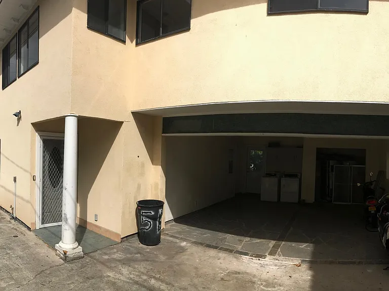 Front Entry Door. Designated covered parking stall. Shared laundry in garage.