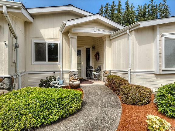Entryway has no steps and a covered porch.
