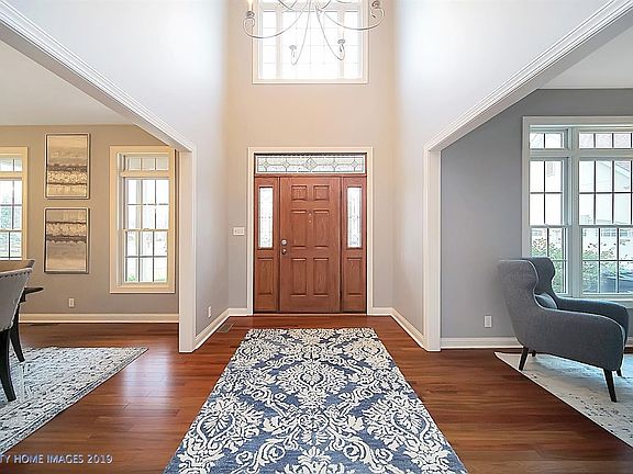 This bright foyer sets the stage for what is to be seen throughout the home. Freshly painted walls and trim and refinished floors can be found throughout the main floor.