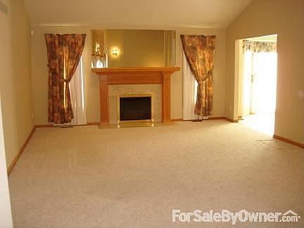 Spacious Living Room
						:
						Cathedral ceiling; gas fireplace with oak mantle and marble/oak surround.