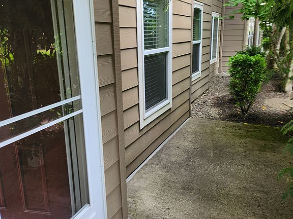 Front patio to the right of door