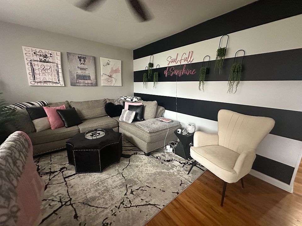 LR with ceiling fan and gleaming HW floors