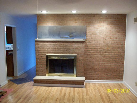 Living room with wood-burning fireplace