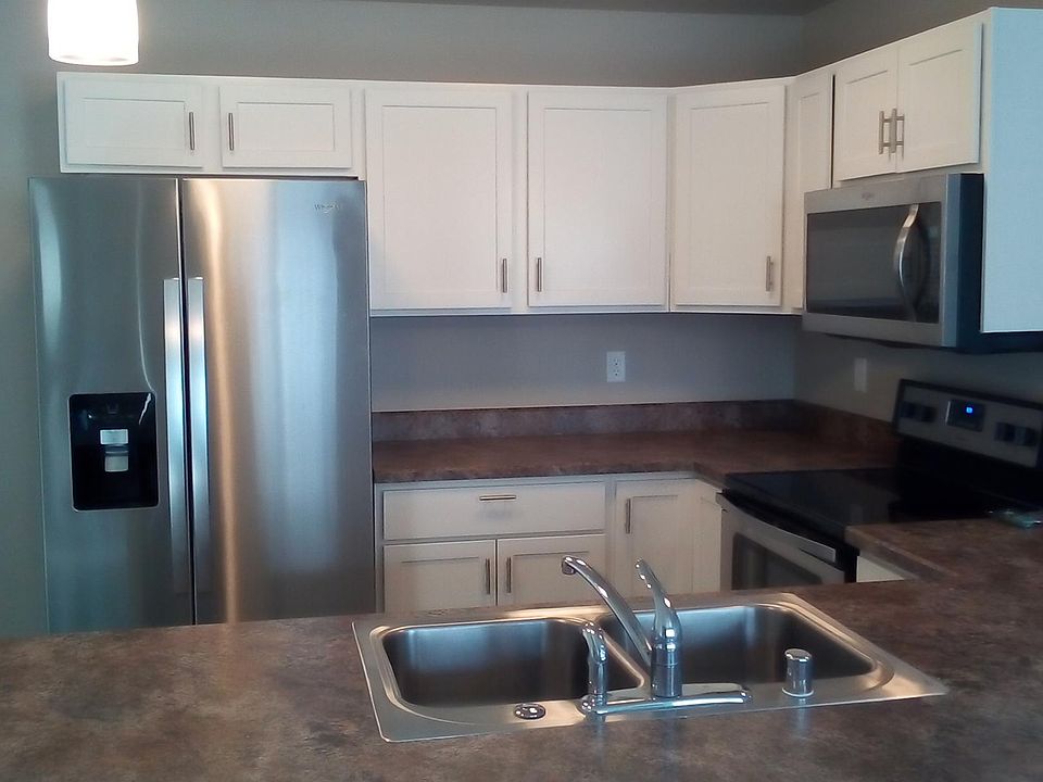 Kitchen Features Stainless Sink w/Garbage Disposal, plus All Whirlpool Appliances, Microwave, Stove, Dishwasher, and Refrigerator/Freezer. Lots of Work Space and Cabinet Storage