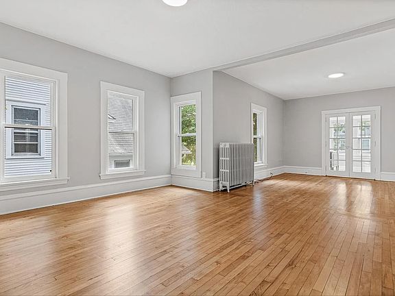 Dinning room, looking into living room (French doors open to bedroom #1)
