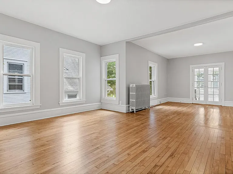 Dinning room, looking into living room (French doors open to bedroom #1)