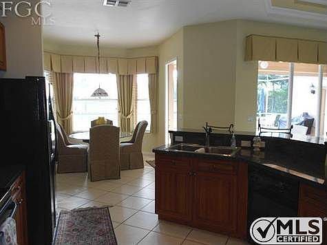 Kitchen area w/ tile on the diagonal
