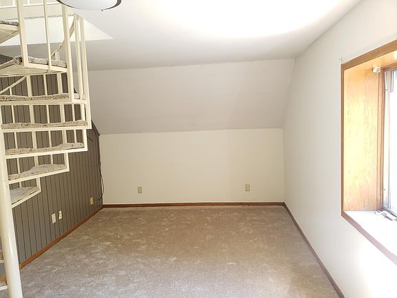 Living room. (Image 3). Stairs to upstairs.