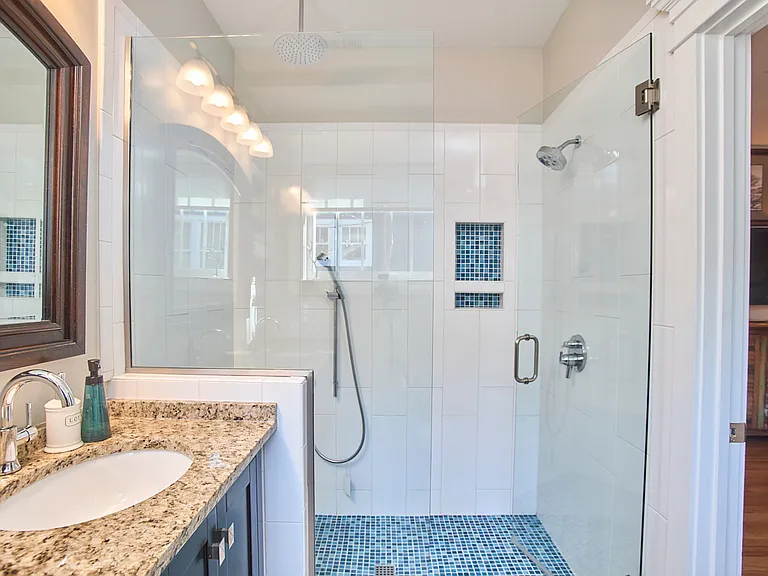 Master bath with oversized shower and three shower heads
Tankless water heater