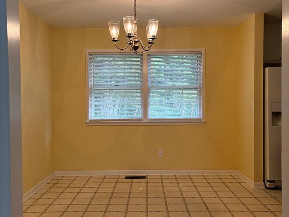 Dining room. Recently repainted "desert fortress" from yellow shown.
