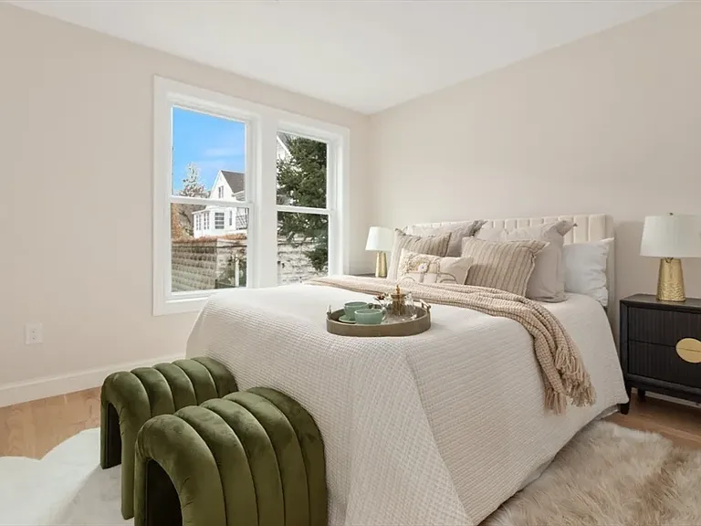 First of two primary bedrooms_spacious, quiet, and features a private en-suite bathroom