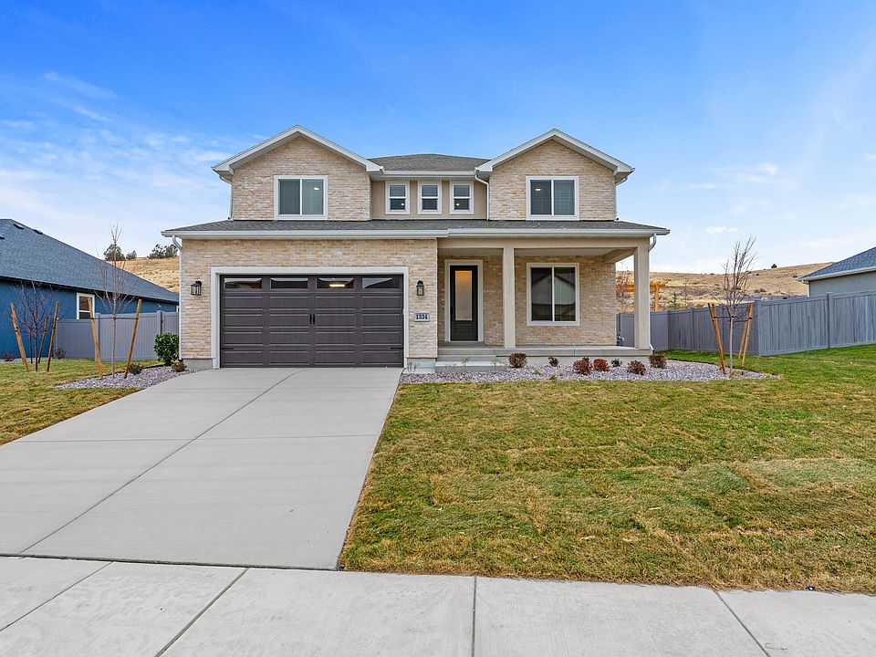 The Mahogany is a beautiful two-story plan.