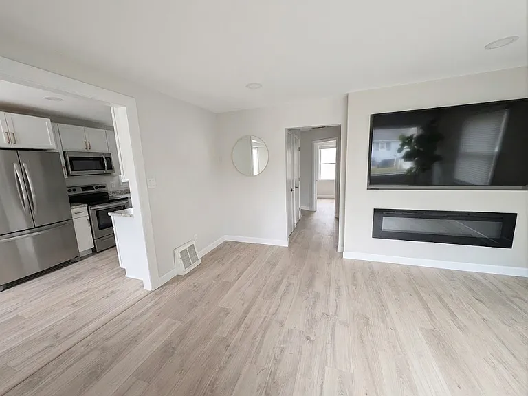 Left: Kitchen
Center: Hallway to main floor bathroom
Right Living room