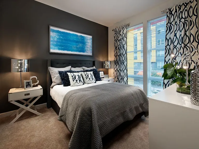 Bedroom with carpet and accent wall