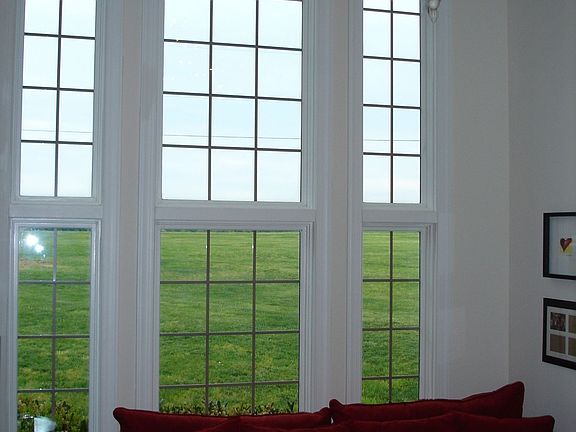 two story sunroom and sitting area off of foyer